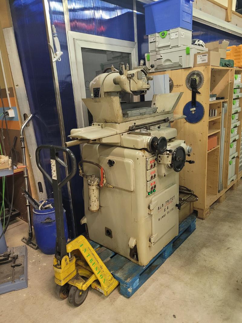 Tripet on its pallet being moved into the workshop with a pallet jack