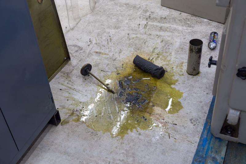 Grinding sludge and oil on the workshop floor