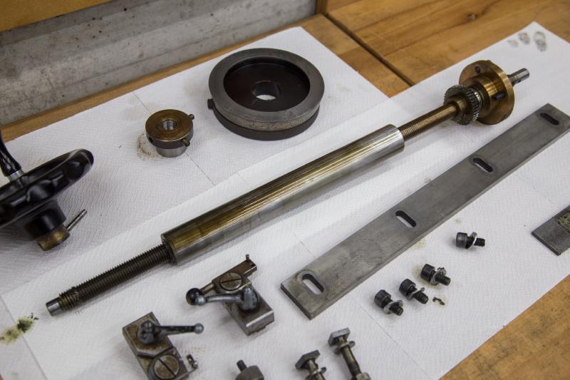 Cross-spindle parts disassembled on paper towels