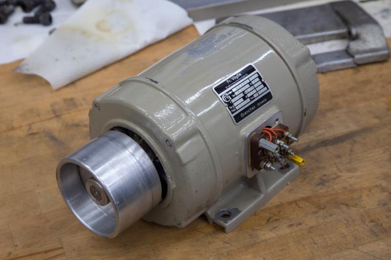 Tripet spindle motor removed and sitting on a bench